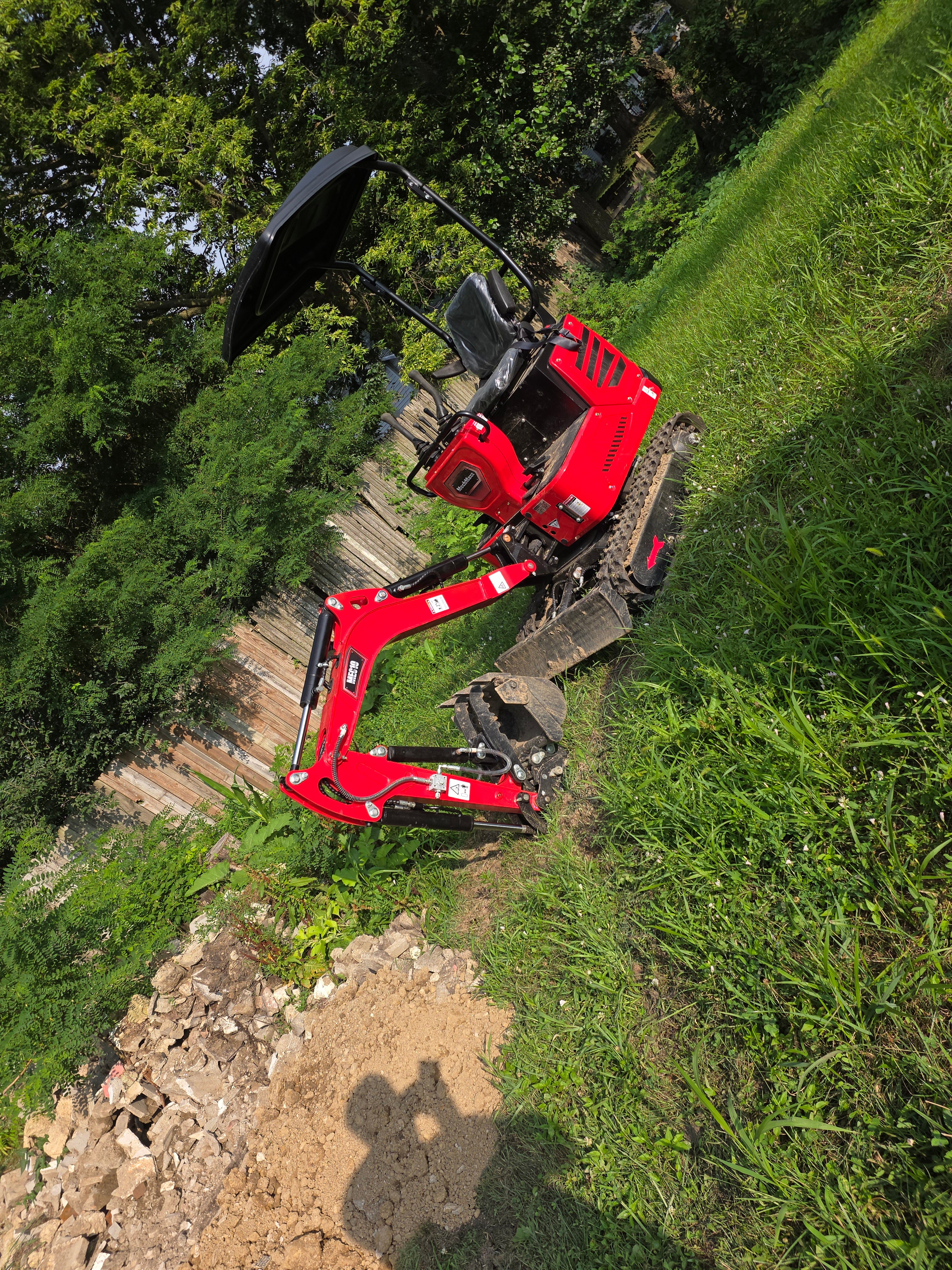 mini excavator being used for drainage